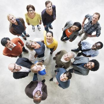 Aerial view of diverse group of people looking up.